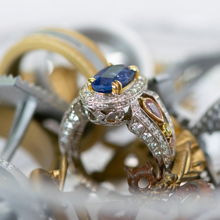 Oval Shape Blue Sapphire Halo Cocktail Ring In Tri-Color Gold