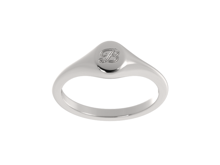 Minimalist ladies’ signet ring with custom script initial in solid gold or silver. Dainty, heirloom-quality personalized jewelry for women.